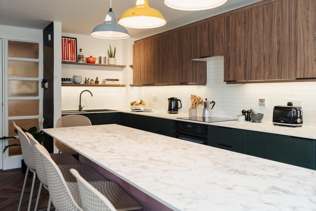 Property photo 2 of 4 A Sleek, Modern Kitchen Featuring A Spacious Marbl...