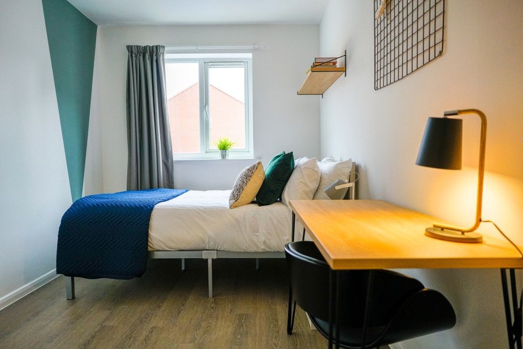 Property photo 3 of 10 A Bright And Modern Living Room Featuring A Comfor...