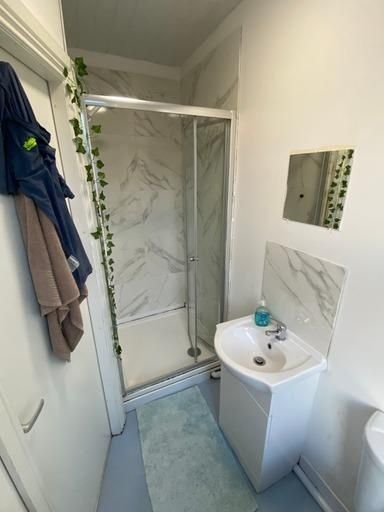 Property photo 1 of 15 A Clean And Modern Bathroom With A Shower Enclosur...