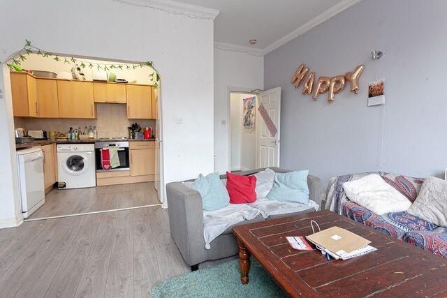 Property photo 3 of 15 A Cozy Living Room Featuring Comfortable Sofas Wit...