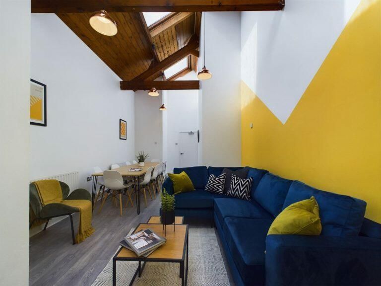 Property photo 2 of 9 Bright And Inviting Living Room Featuring A Spacio...