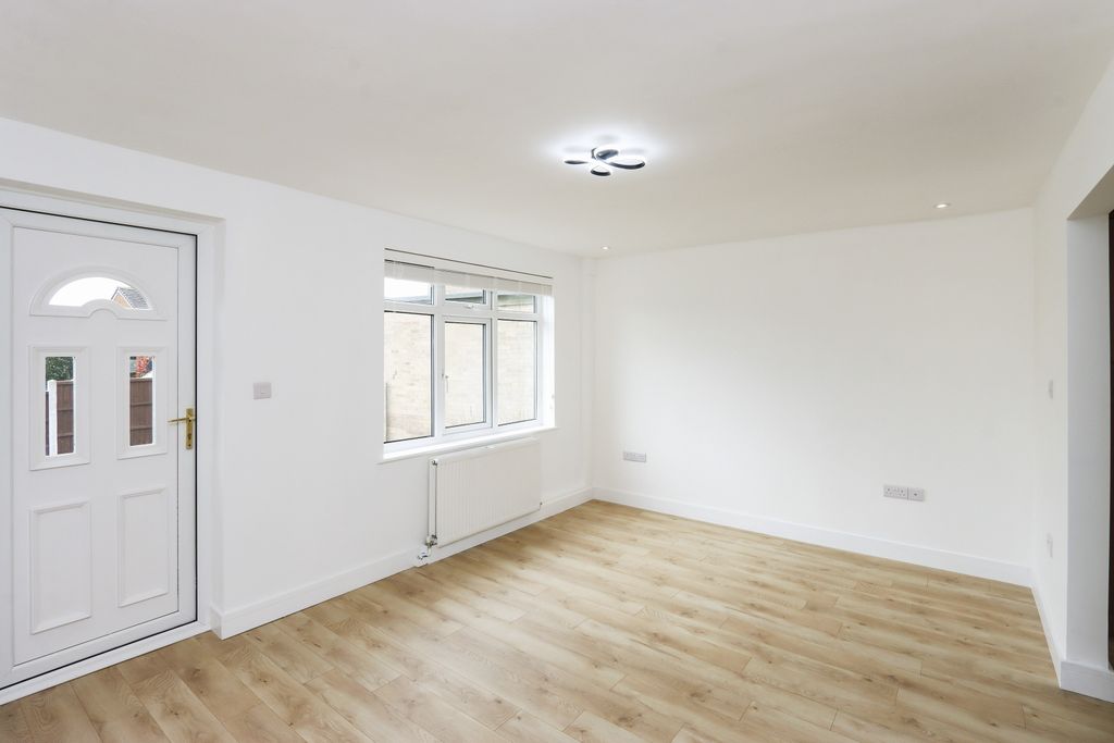 Property photo 2 of 28 Bright Living Area With Large Rear Windows And Warm LED Lighting.