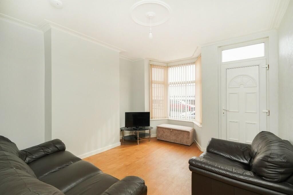 Property photo 3 of 12 Bright And Welcoming Living Room Featuring Comfort...