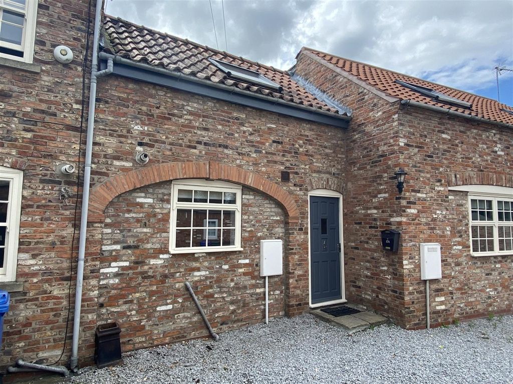 Property photo 1 of 6 Charming Brick Exterior With Modern Front Door...