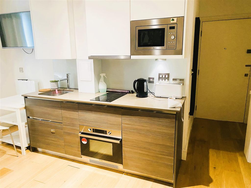 Property photo 3 of 7 Kitchen Area