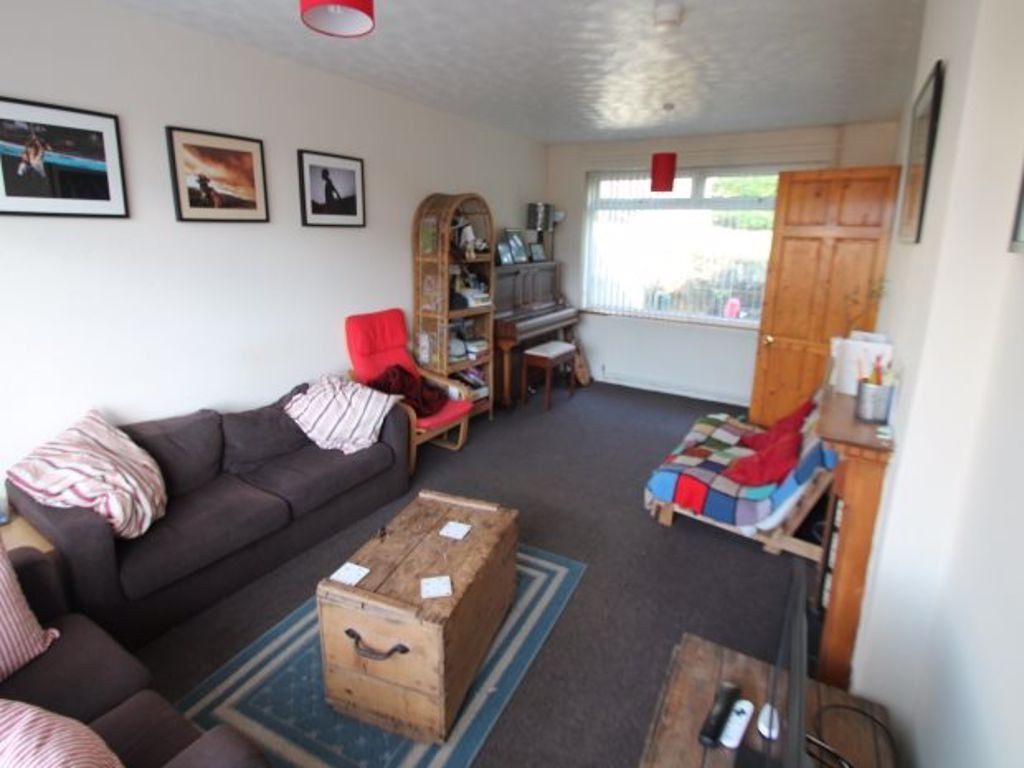 Property photo 1 of 6 A Cozy Living Room Featuring A Comfortable Sofa, A...