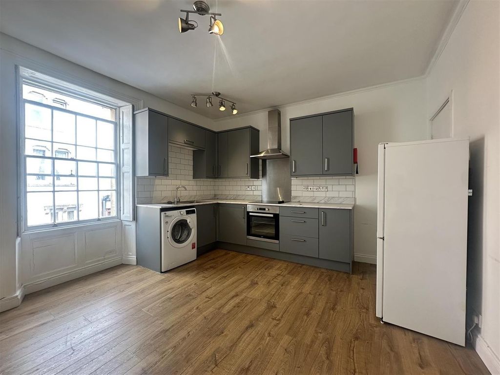 Property photo 1 of 7 Modern Kitchen With Sleek Units And Bright Window...