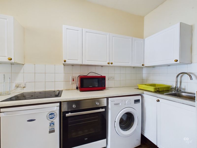 Property photo 2 of 12 Kitchen Area
