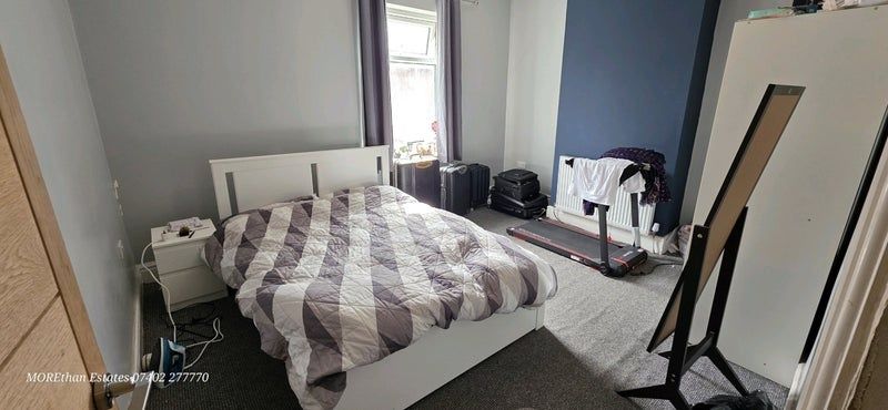 Property photo 3 of 7 A Well-Lit Double Bedroom Featuring A Comfortable ...