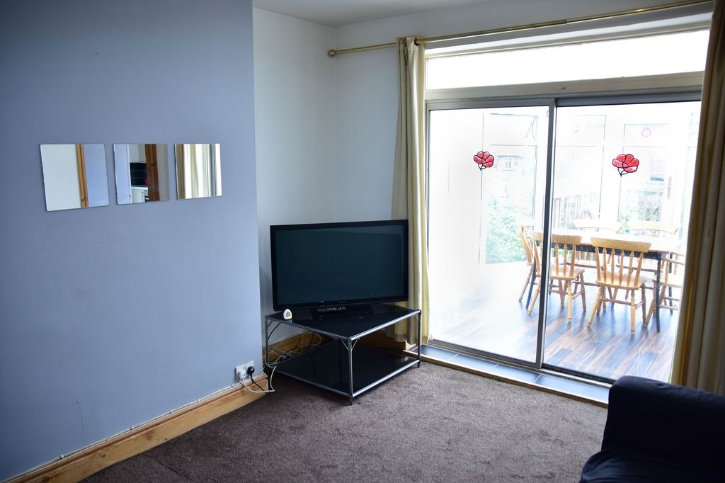 Property photo 2 of 5 Bright And Welcoming Living Room With A Large Slid...