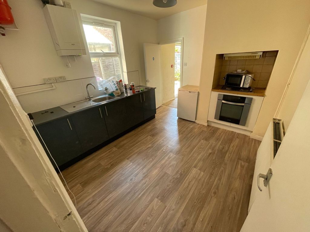 Property photo 2 of 4 A Neat And Functional Kitchen Featuring Modern Woo...