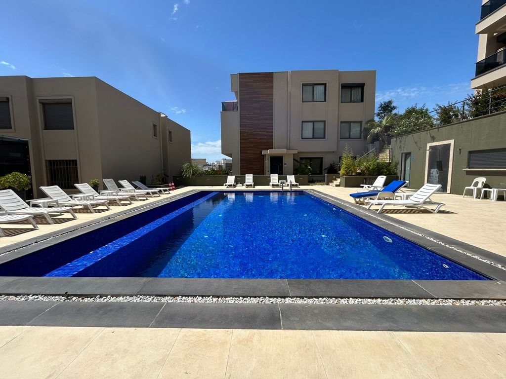Property photo 1 of 18 Sea View Bodrum Apartment In Bardakci Koyu For Sale Â€“ Main View Of Apartment Block And Communal Pool