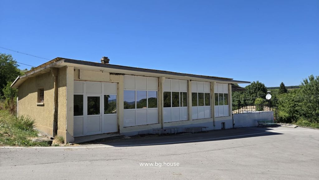 Property photo 1 of 52 Exterior View Of The Commercial Building Showing Large White-Framed Windows And Entrance Door