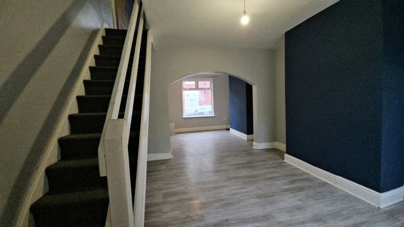 Property photo 1 of 6 A Clean And Modern Hallway Featuring Light Wood Fl...