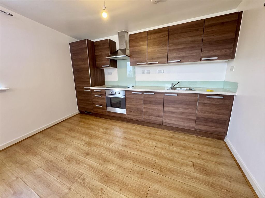 Property photo 2 of 8 Kitchen Area