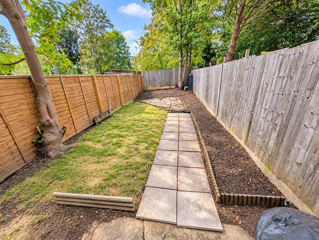Property photo 3 of 8 Leafy Suburban Garden Path.Png