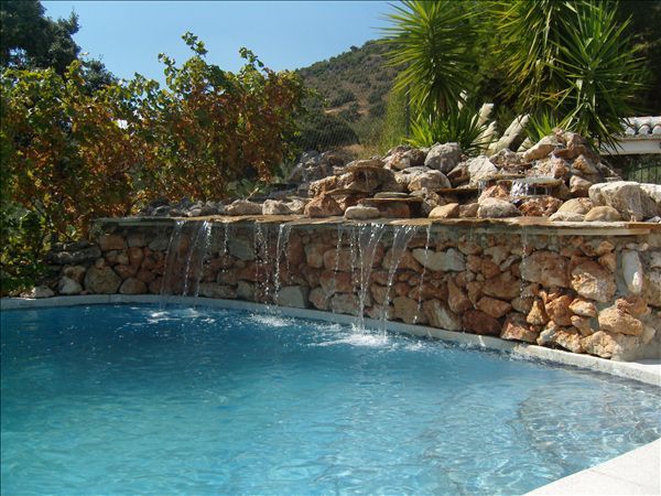 Property photo 1 of 90 Swimming Pool Natural Stone Built Waterfall With Backdrop Of Mountain