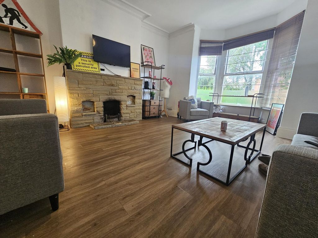 Property photo 2 of 17 Bright And Welcoming Living Room Featuring A Large...
