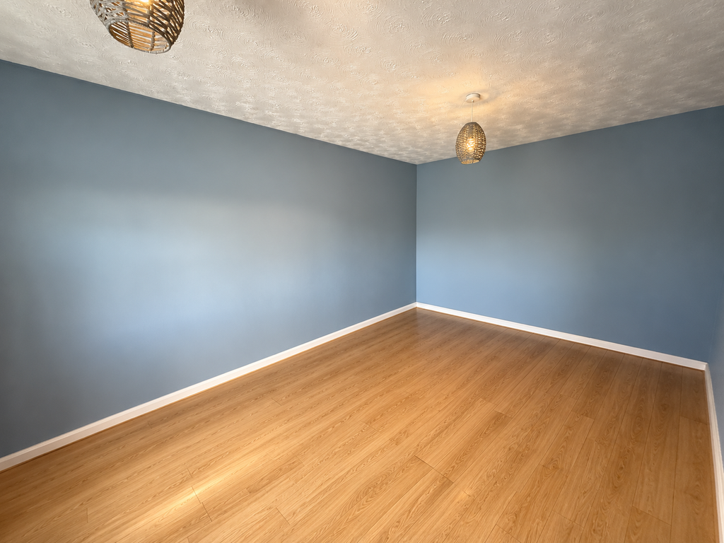 Property photo 2 of 3 Empty Blue-Grey Room With Woven Pendant Lights