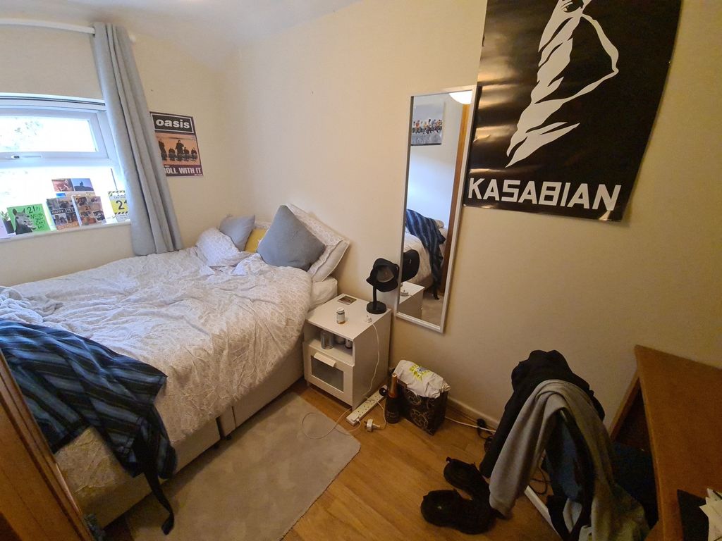 Property photo 3 of 18 Cozy And Compact Bedroom Featuring A Comfortable S...