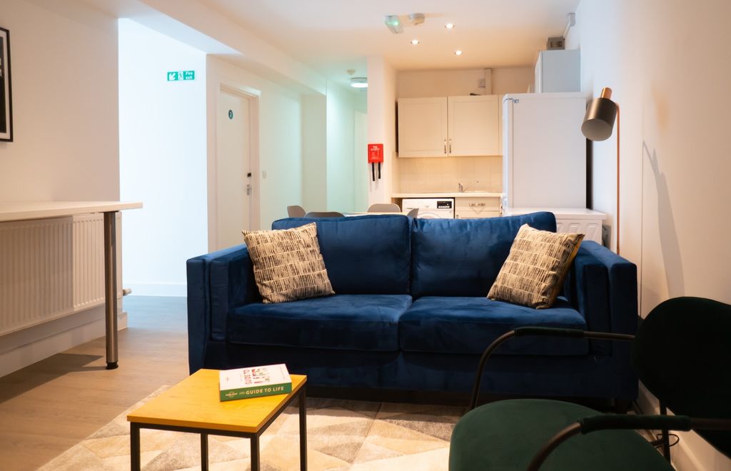 Property photo 2 of 6 A Bright And Inviting Living Room Featuring Modern...