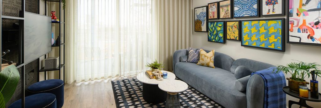 Property photo 3 of 5 Modern Designed Living Space With Sofa And Coffee Table, Ample Natural Lighting From Tall Windows.