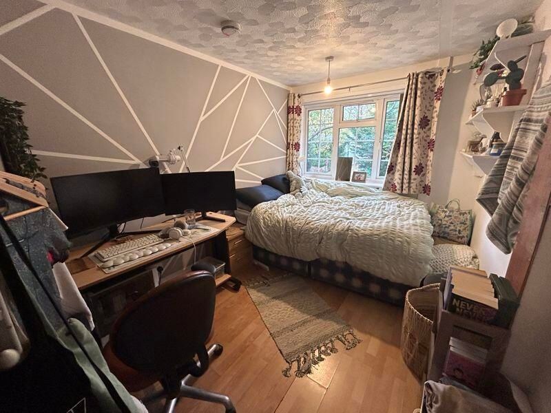 Property photo 3 of 10 A Cozy And Well-Lit Living Room Featuring A Comfor...