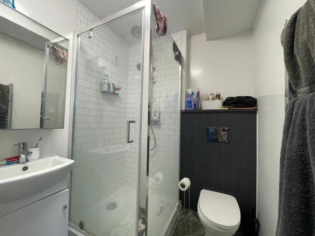 Property photo 3 of 4 A Modern, Clean Bathroom Featuring A Shower Enclos...