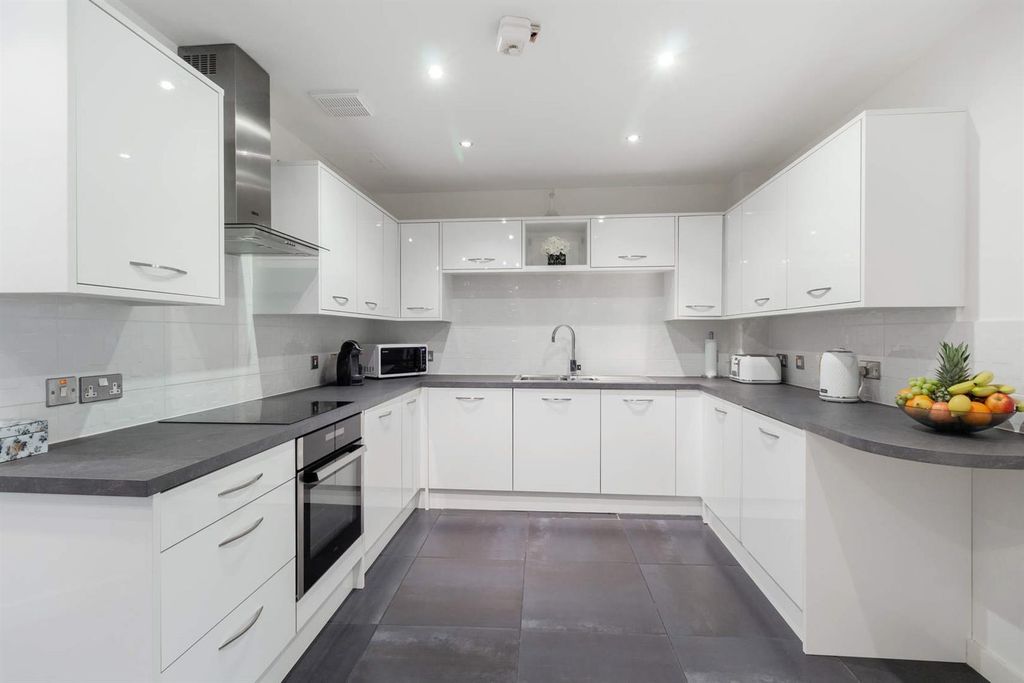 Property photo 3 of 10 Modern White Kitchen With Ample Counter Space...