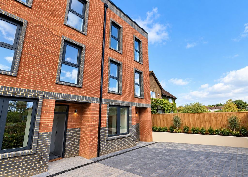 Property photo 3 of 25 Modern Brick Townhouse Exterior.Png