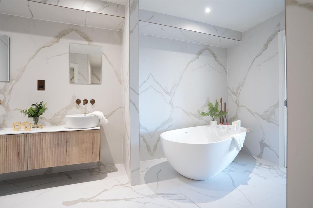 Property photo 1 of 11 Elegant Marble Bathroom With Luxury Bathtub...