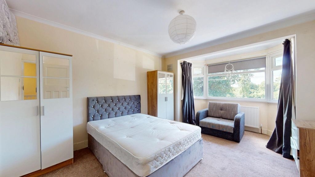 Property photo 1 of 15 Bright And Airy Master Bedroom Featuring A Large d...