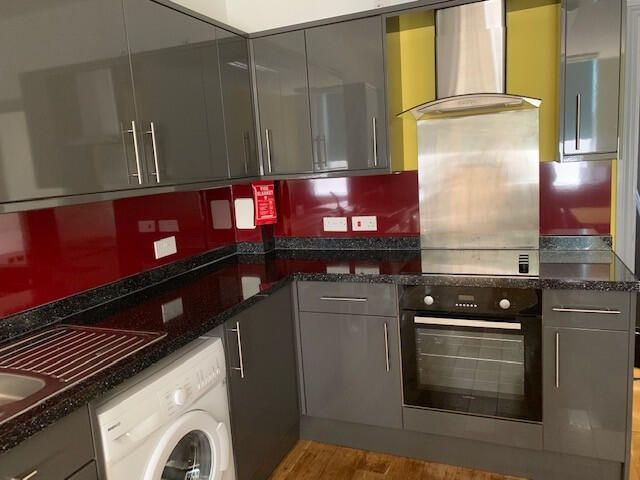 Property photo 3 of 4 Modern Grey Kitchen With Vibrant Red Splashback...
