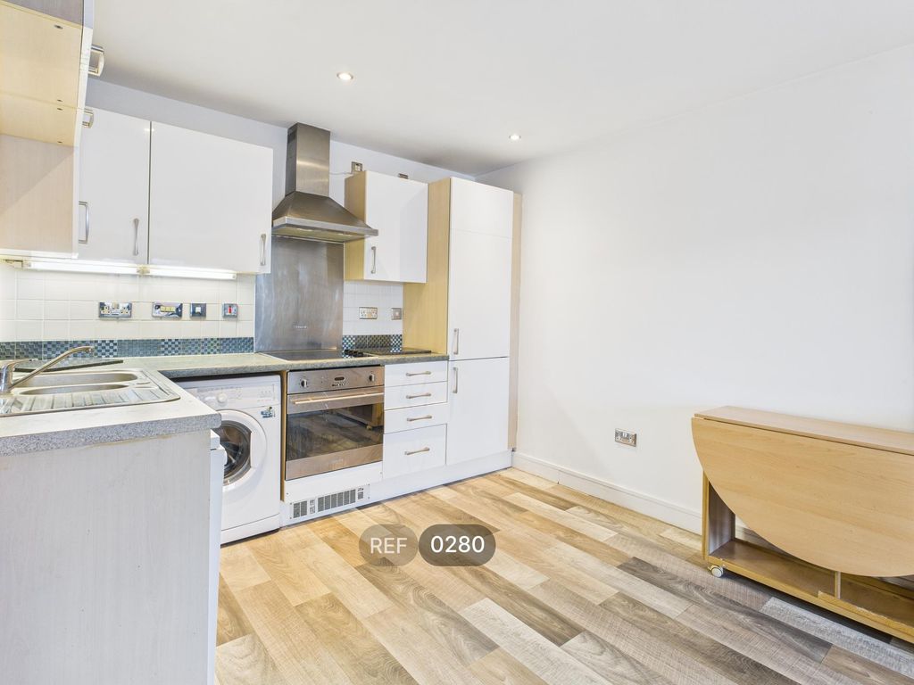 Property photo 2 of 12 Kitchen & Living Area