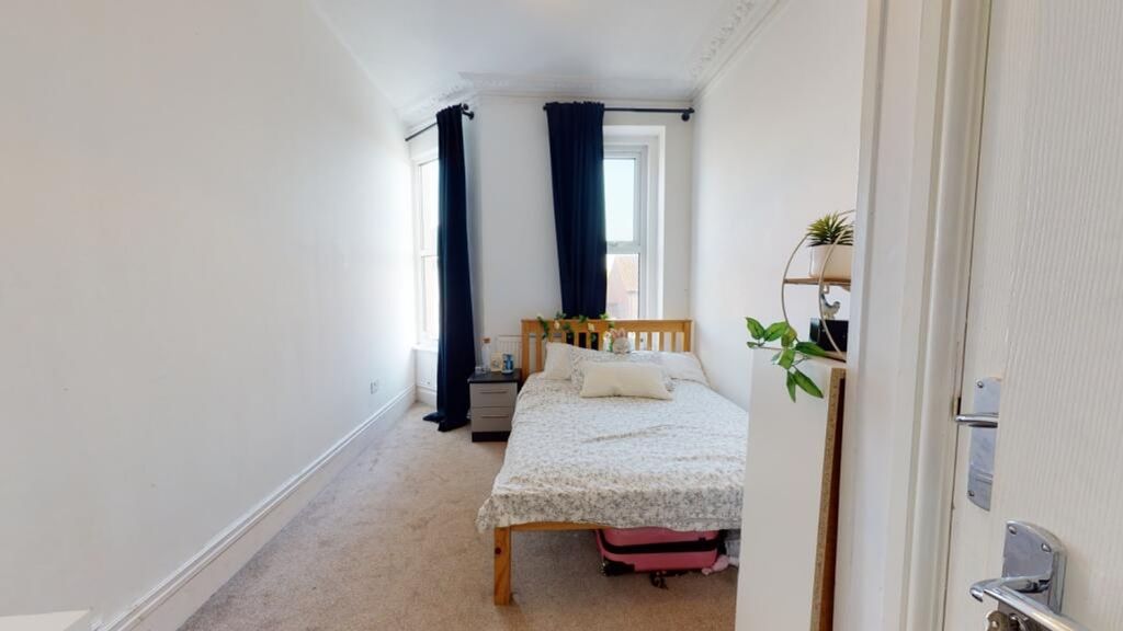 Property photo 1 of 15 Cozy Double Bedroom Featuring A Comfortable Bed, A...