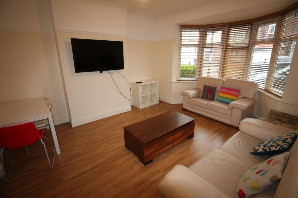 Property photo 1 of 13 Bright And Spacious Living Room Featuring A Comfor...
