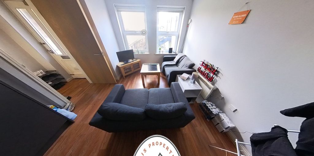 Property photo 2 of 4 A Bright, Modern Living Room Featuring Comfortable...