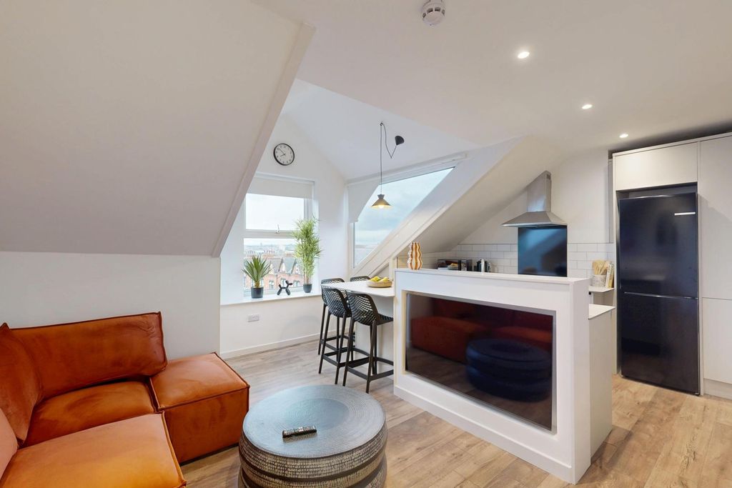 Property photo 1 of 18 Bright And Modern Living Area Featuring A Comforta...