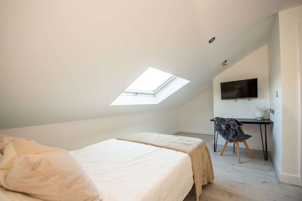 Property photo 3 of 6 Bright And Airy Bedroom Featuring A Comfortable Do...