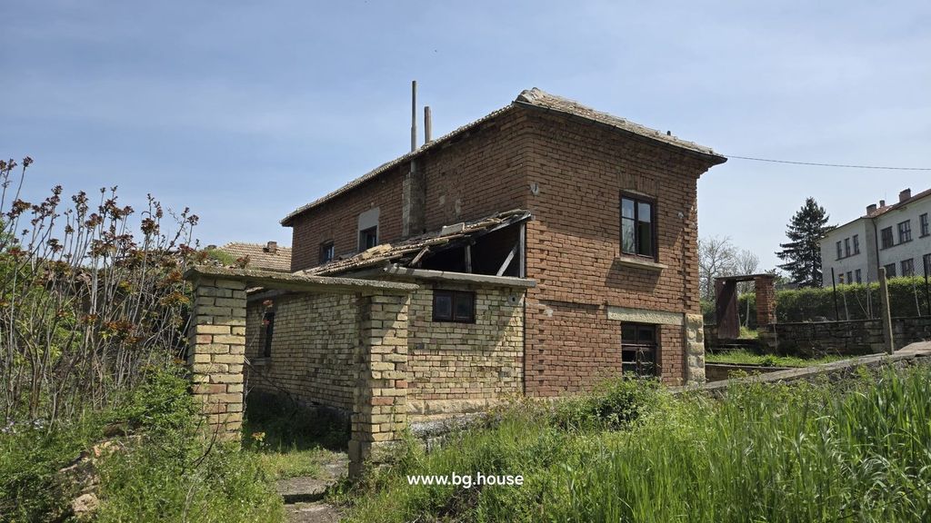 Property photo 3 of 53 Side Perspective Of The House Showing Brick Walls, Annex, Windows, And Surrounding Green Plants