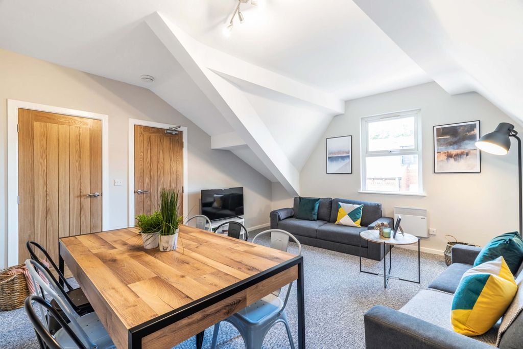 Property photo 3 of 17 Bright, Modern Living Room Featuring Comfortable S...