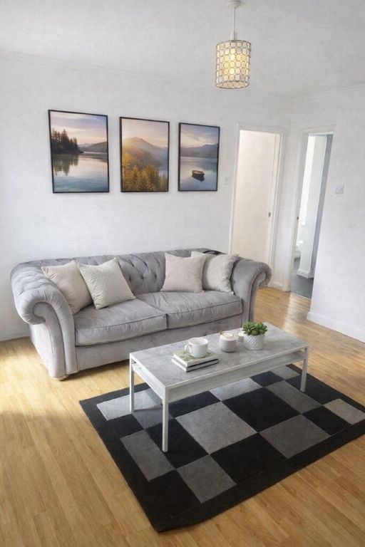 Property photo 1 of 9 Stylish Lounge With Plush Sofa And Modern Art...