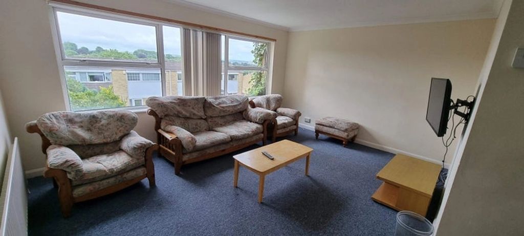 Property photo 1 of 8 A Cozy Living Room Featuring A Set Of Floral Uphol...