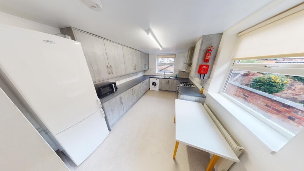 Property photo 1 of 10 Bright And Modern Kitchen Featuring Plenty Of Cabi...