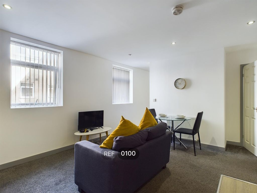 Property photo 2 of 7 Kitchen & Living Area