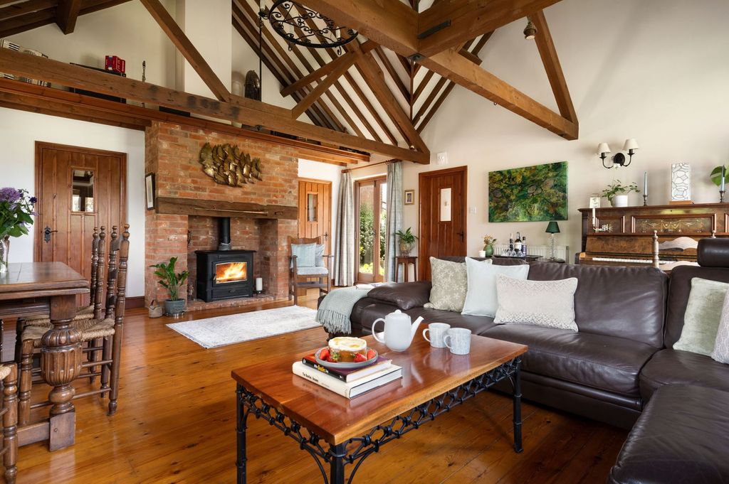 Property photo 2 of 27 Living Room With Fireplace Lit
