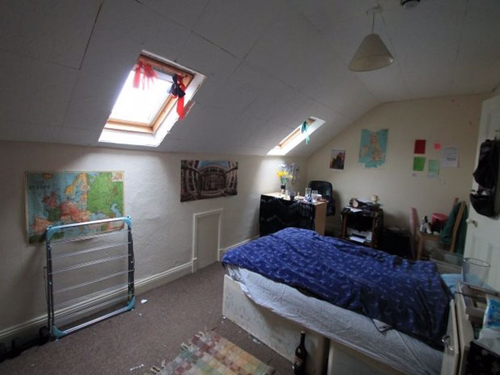 Property photo 3 of 9 A Cozy Attic Master Bedroom Featuring Angled Skyli...