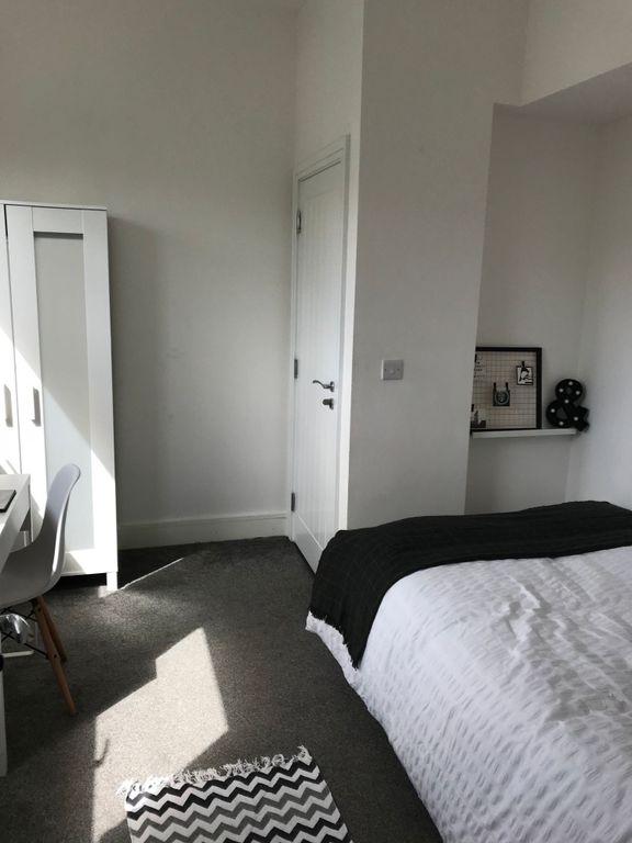 Property photo 2 of 19 This Stylish Double Bedroom Features Ample Natural...