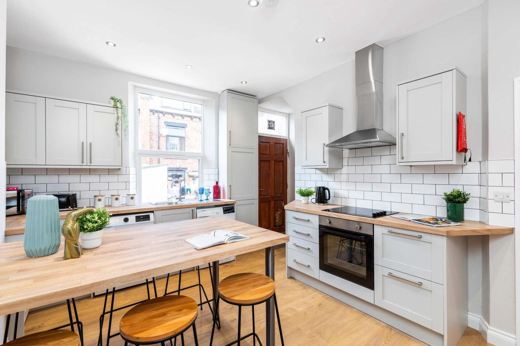 Property photo 2 of 7 Bright, Modern Kitchen With White Cabinetry, Subwa...