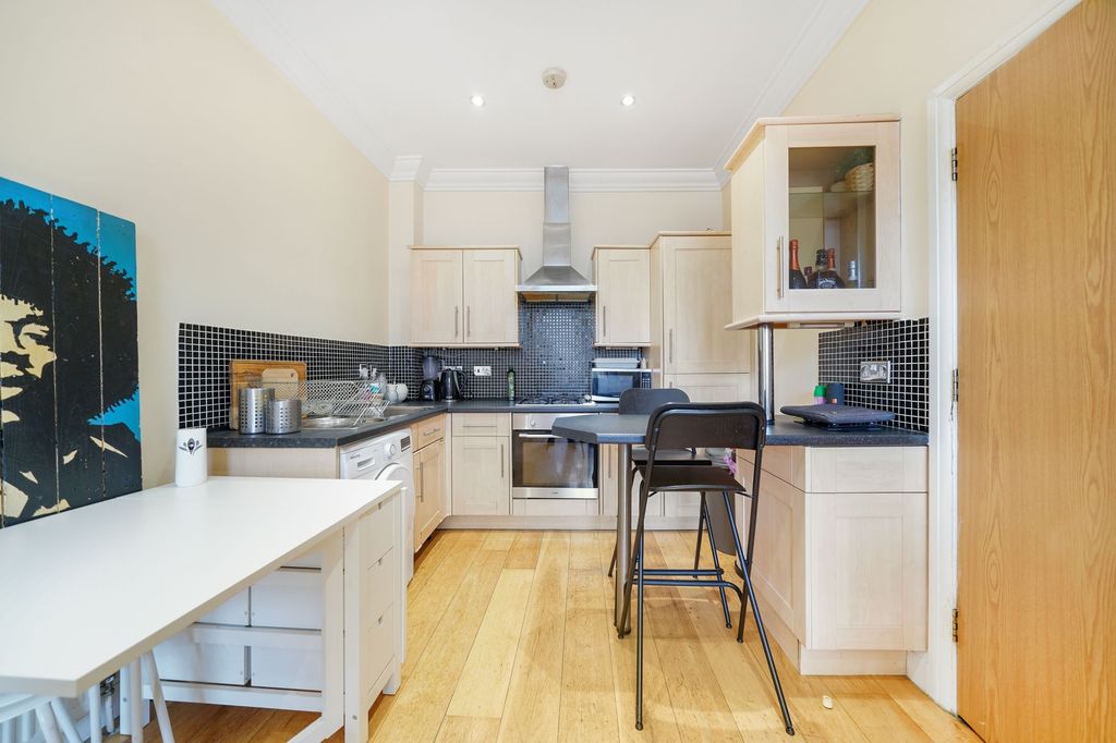 Property photo 1 of 15 Bright And Tidy Kitchen With Modern Light Wood Cab...